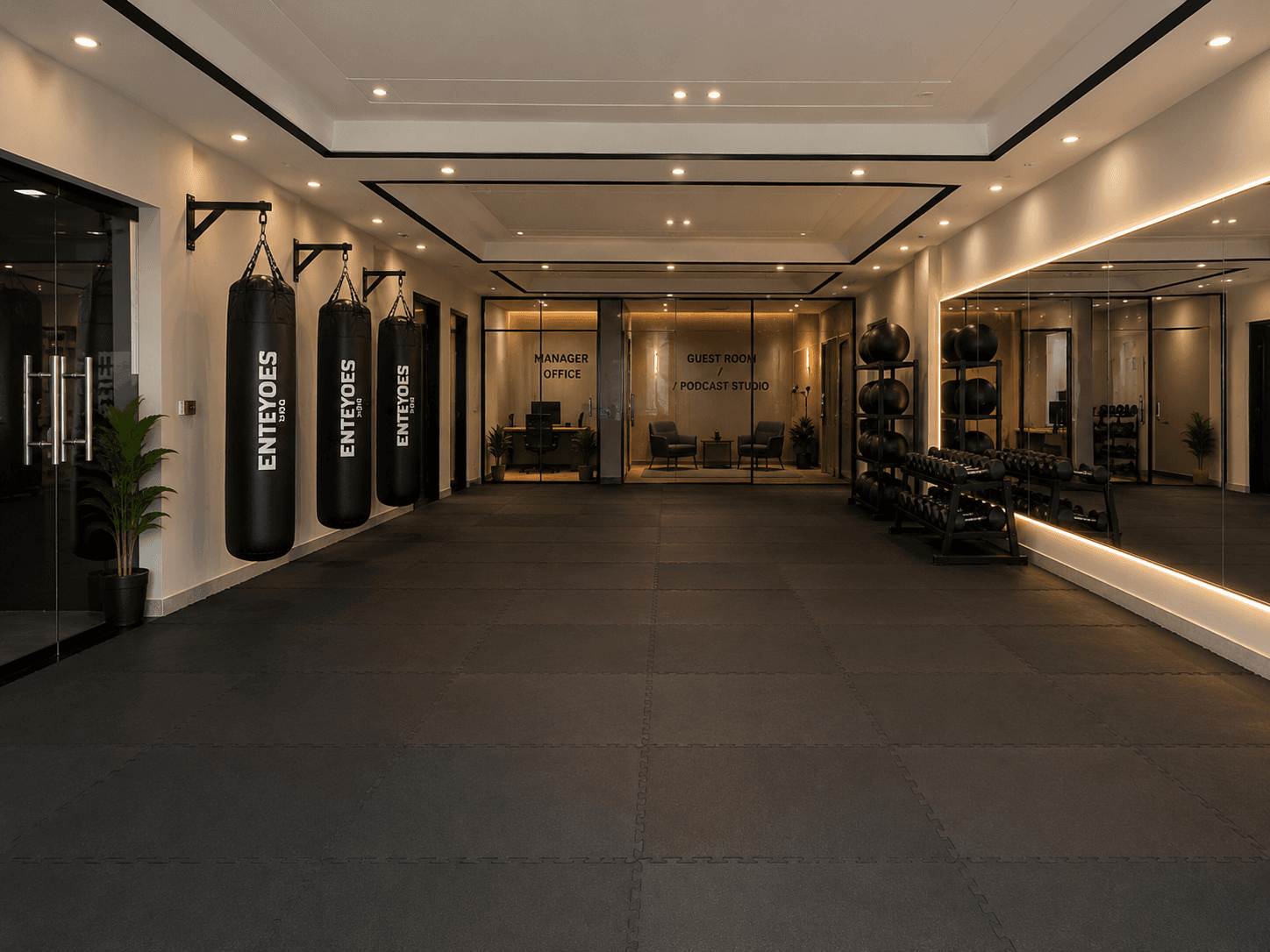 Enteyoes Gym — branded boxing bags and functional training area
